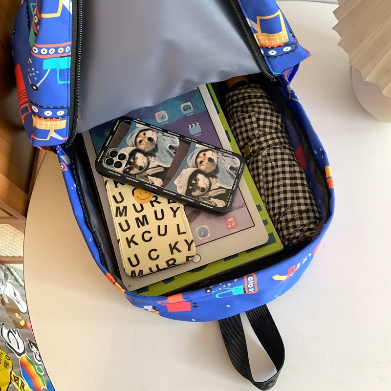 Cartoon Dinosaur Backpack with Graffiti Print Three Piece Set Large Capacity Student Backpack